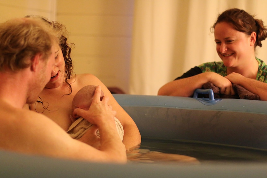 Bronwyn Moir looks on at new parents in birth pool