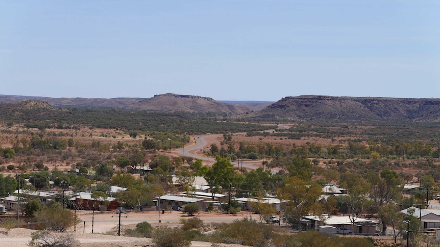 An aerial shot shows the town of Santa Teresa