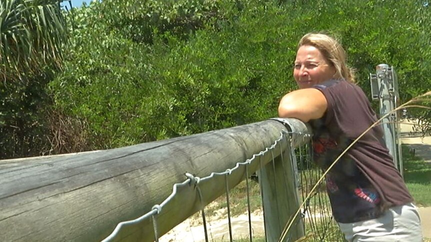 Bilinga resident Diana Gillies looks over dunes where homeless people are setting up camp