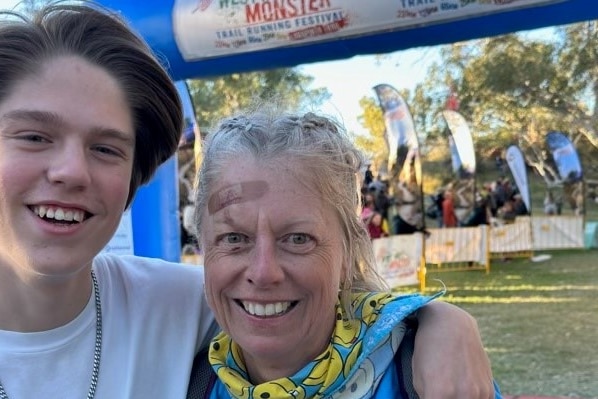 Jodie and her son Jacob at the finish line of the West Macs Monster trail running festival