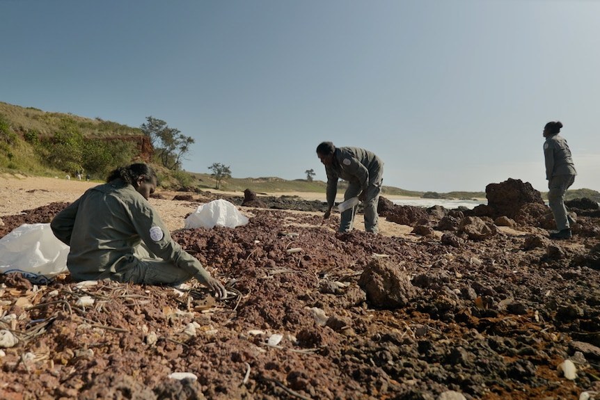 Indengenous rangers from East Arnhem Land collect rubbish from a beach