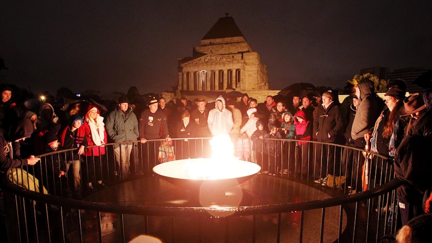 People gather at the Shrine of Remembrance in Melbourne for dawn service.