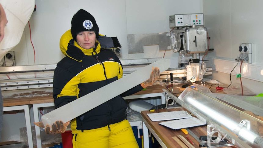 Dr Tessa Vance holds an ice core sample