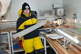 Dr Tessa Vance holds an ice core sample