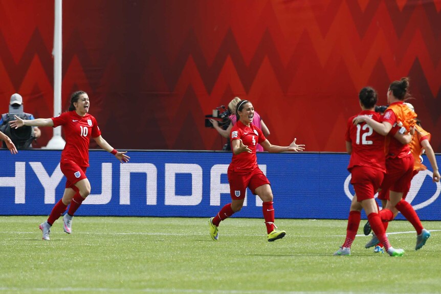 England celebrates Fara Williams' game winner against Germany