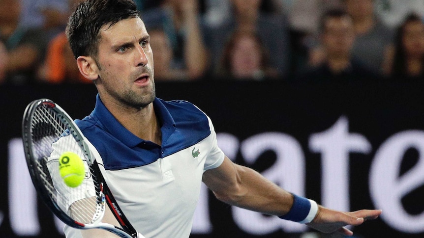 Novak Djokovic hits a forehand return during the fourth round match at the Australian Open.