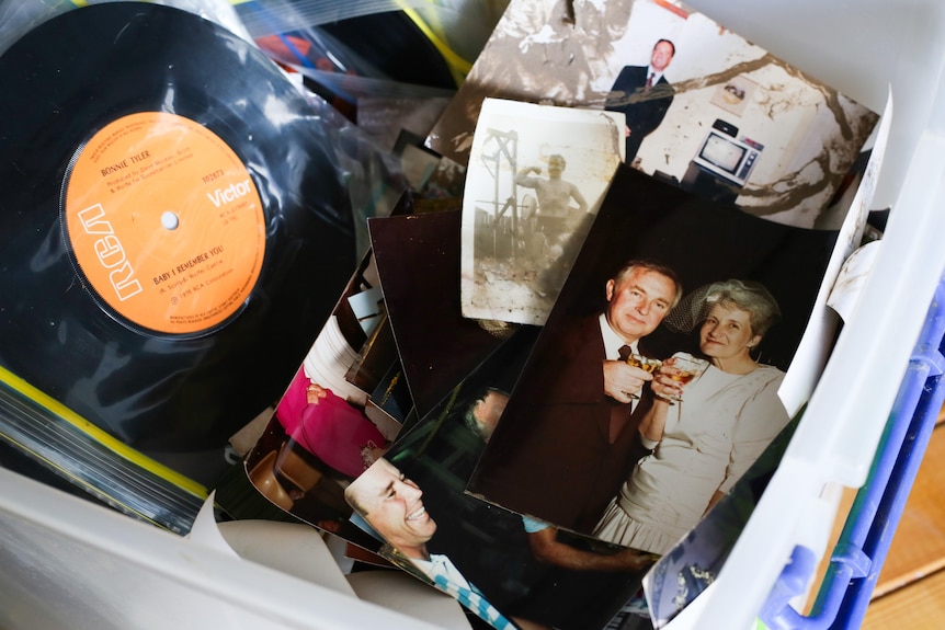 Box of family photos as a record wrapped in plastic