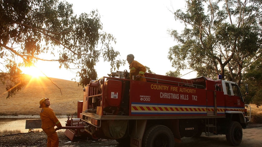 Firefighters refill truck at Christmas Hills