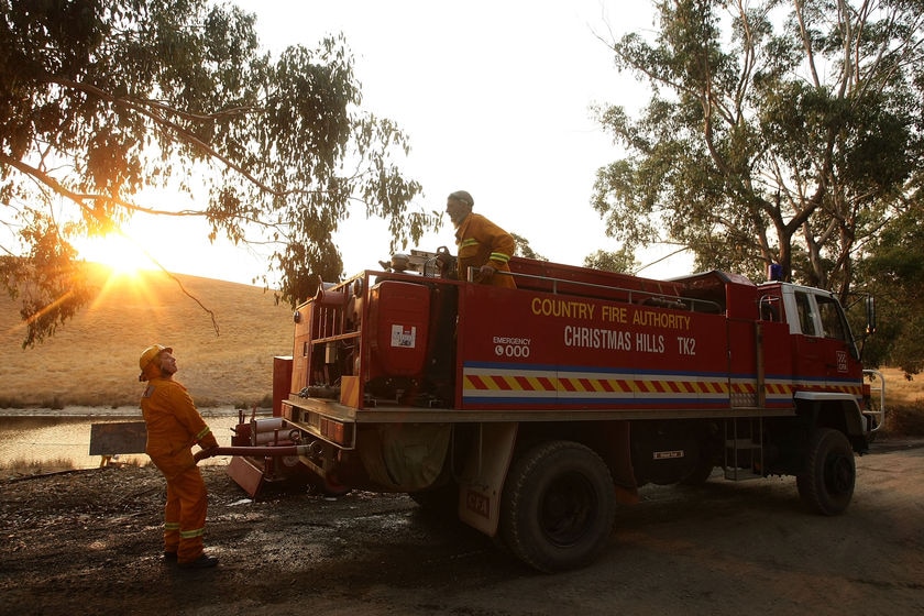 Firefighters refill truck at Christmas Hills