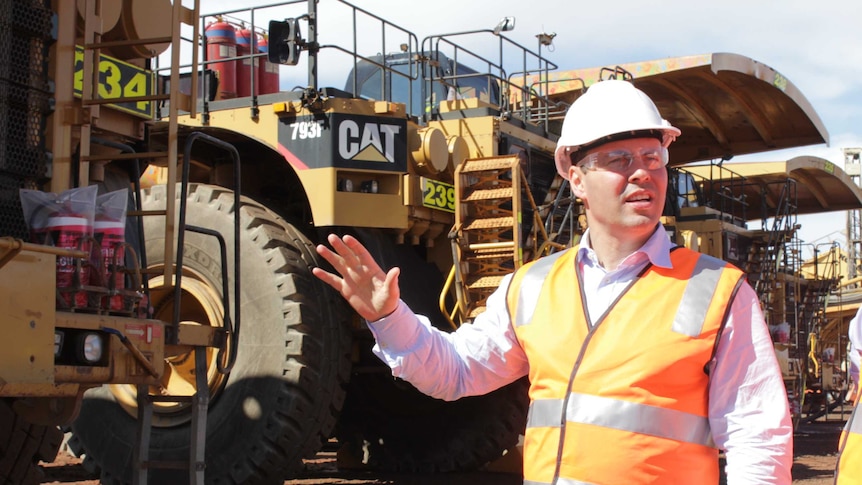 Federal Resources Minister Josh Frydenberg inspects trucks at the Super Pit in Kalgoorlie.