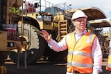Federal Resources Minister Josh Frydenberg inspects trucks at the Super Pit in Kalgoorlie.