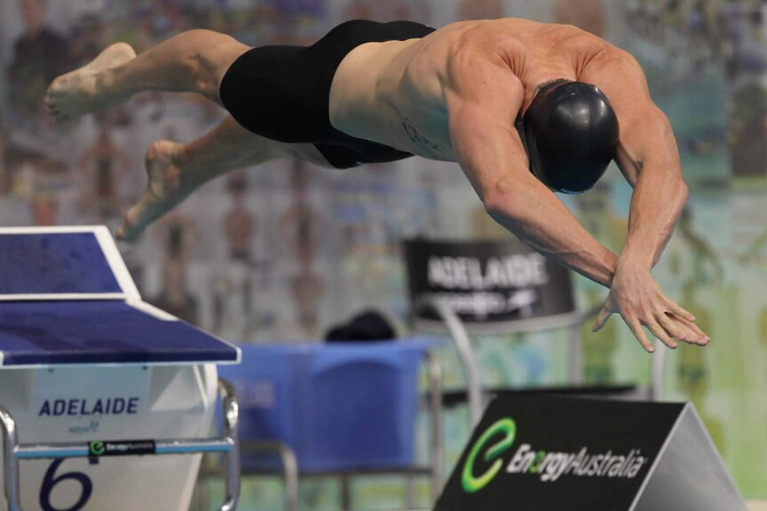 James Magnussen dives into the pool