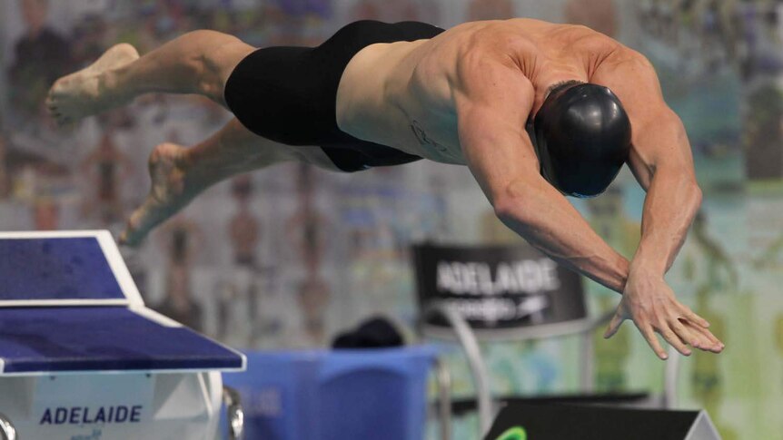 James Magnussen dives into the pool