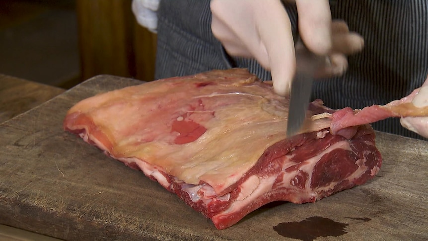 Photo of goat meat being cooked