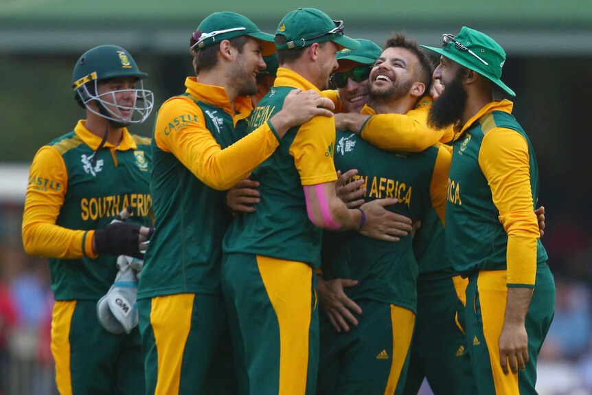 Historic win ... JP Duminy celebrates a wicket with his Proteas team-mates