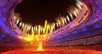 Fireworks explode over the National Stadium during the Beijing Olympic Games closing ceremony.