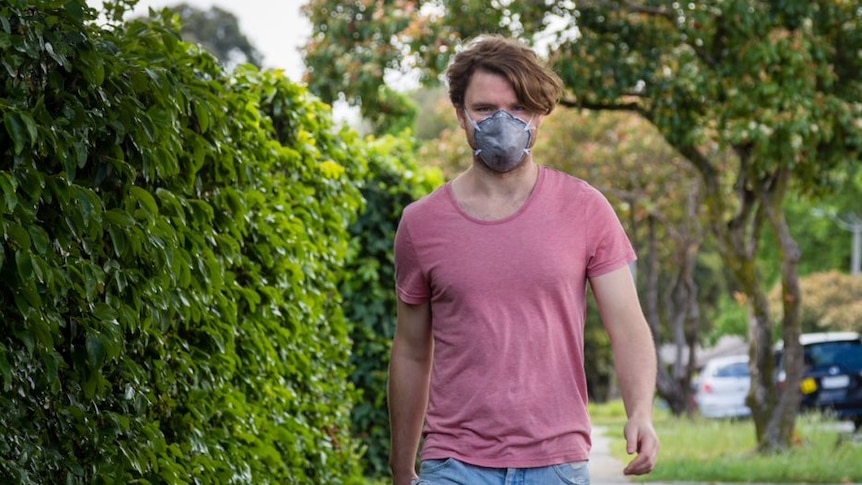 Tim Kirby wears a mask, which he uses on days when air pollutants are high.
