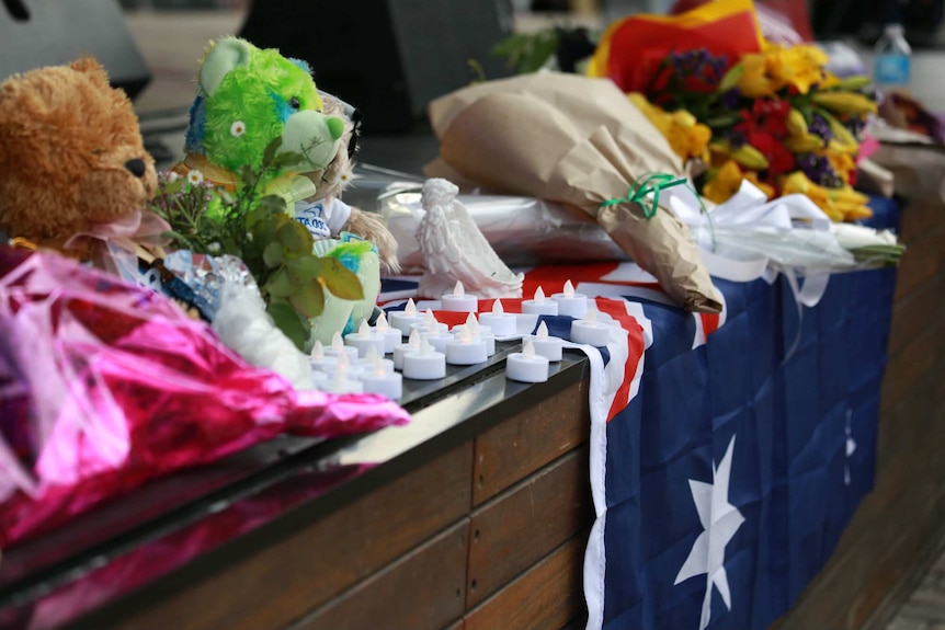 Teddies and flowers at the Bourke Street vigil.