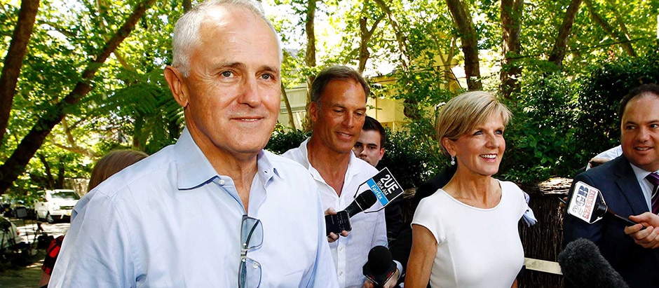Communications Minister Malcolm Turnbull greets Foreign Minister Julie Bishop at a fundraiser in Sydney, February 8, 2015.