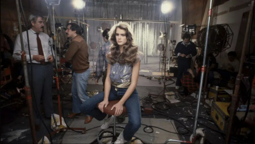 Young Brooke Shields sitting on a film set