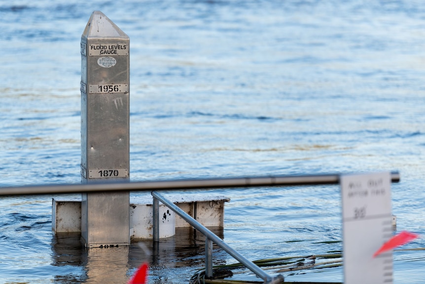 A gauge with the years 1870 and 1956 show the level of recent flood levels