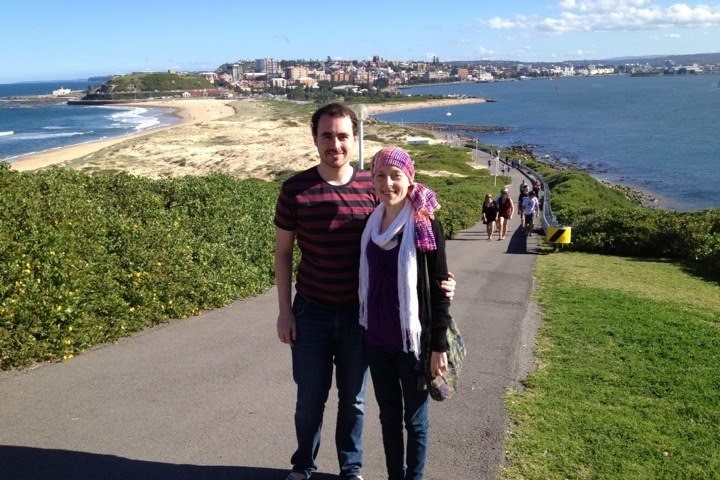 Hannah Perkins wearing a headscarf and walking with her brother in Newcastle.