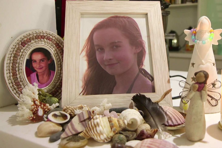 Picture frames of Shannon, "a fun loving girl who loved to swim", are displayed in the family home