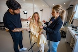 A social media influencer gets her hair and make up done