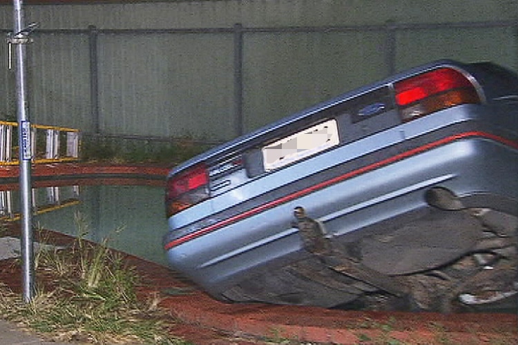 A car rests in a pool at Flagstaff Hill