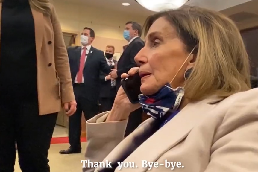 Nancy Pelosi speaking on a mobile phone 