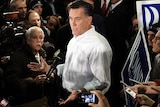 Mitt Romney talks to the press after addressing a speech at Gilchrist Metal Fabricating in Hudson, New Hampshire