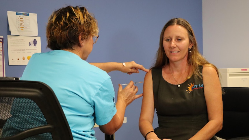 A woman receiving her COVID-19 vaccination in Palmerston.