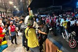 People gathetr in the street in Butuan City after an earthquake. 