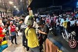 People gathetr in the street in Butuan City after an earthquake. 