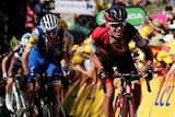 Richie Porte grimaces as he pushes ahead of the peloton during the fifth stage of the Tour de France.