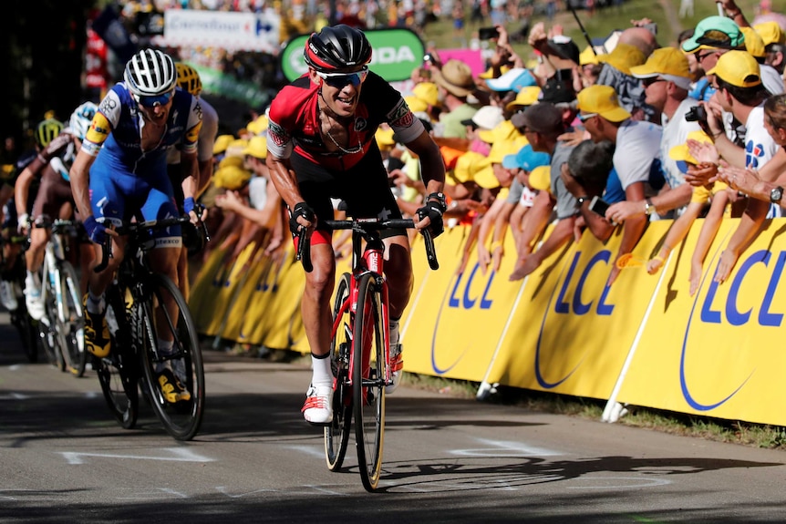 Richie Porte grimaces as he pushes ahead of the peloton during the fifth stage of the Tour de France.
