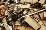 A huge pile of discarded chairs and tables