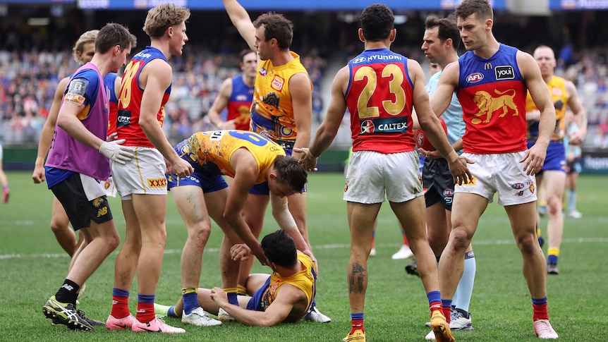 Players call for medical attention with Liam Duggan down and dazed