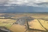 View from a helicopter showing flooding across paddocks devastating crops.