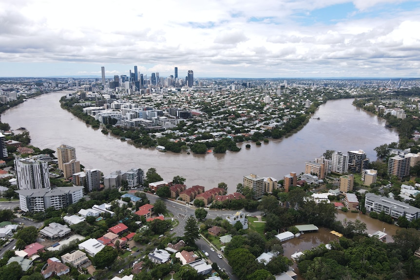 View of Brisbane River in flood CBD in background