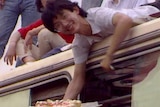 A man hands out cake in Tiananmen Square