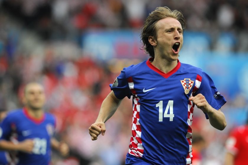 Luka Modric celebrates after scoring a penalty