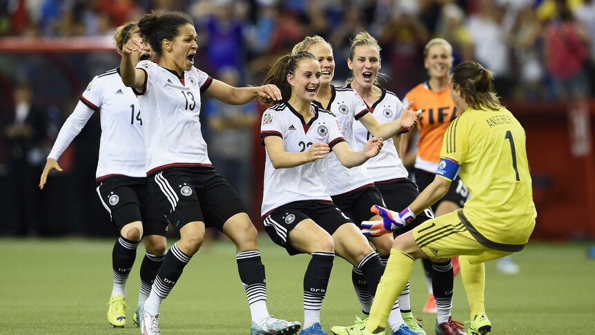 Thrilling win ... Nadine Angerer (R) celebrates with her Germany team-mates after saving the final penalty against France
