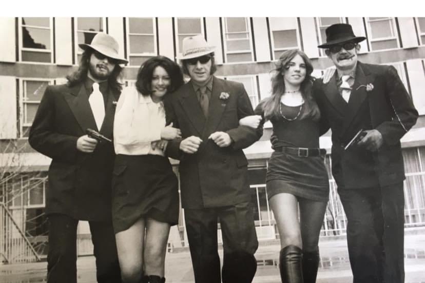 Geoff Harcourt dressed as Frank Sinatra with colleague Fred Bloch and students in 1970.