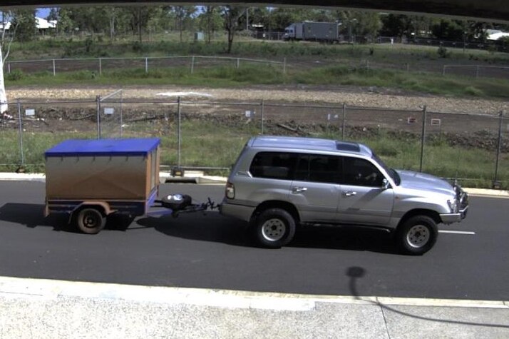 CCTV image of a trailer being towed by a four-wheel-drive.