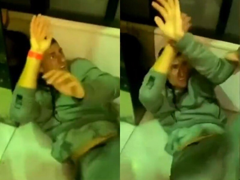 A composite image featuring two stills from video footage of a man on the floor with his arms raised.