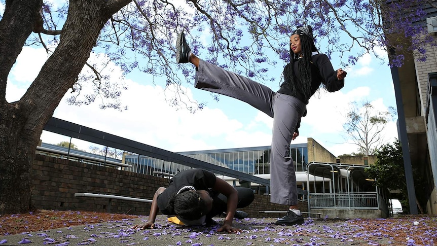 17-year-old Ayat Akeg practising moves she has learnt in the Capoeira Angola class at Pendle Hill High School.