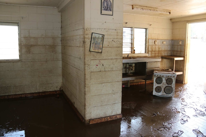 A muddy house after the flood receded, Nauiyu