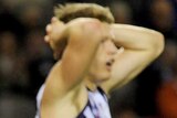 Fremantle players look on as St Kilda romps to shock win