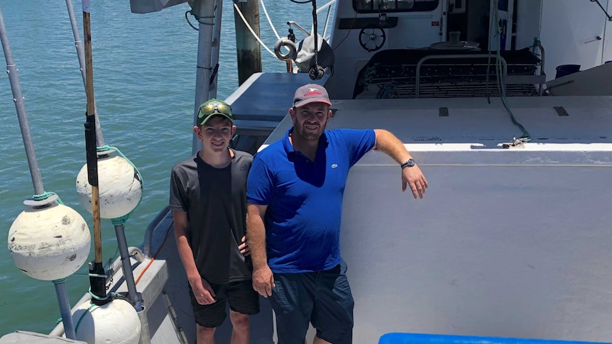 Father and son, Peter and George Rockliff on board their boat Barameda-K.